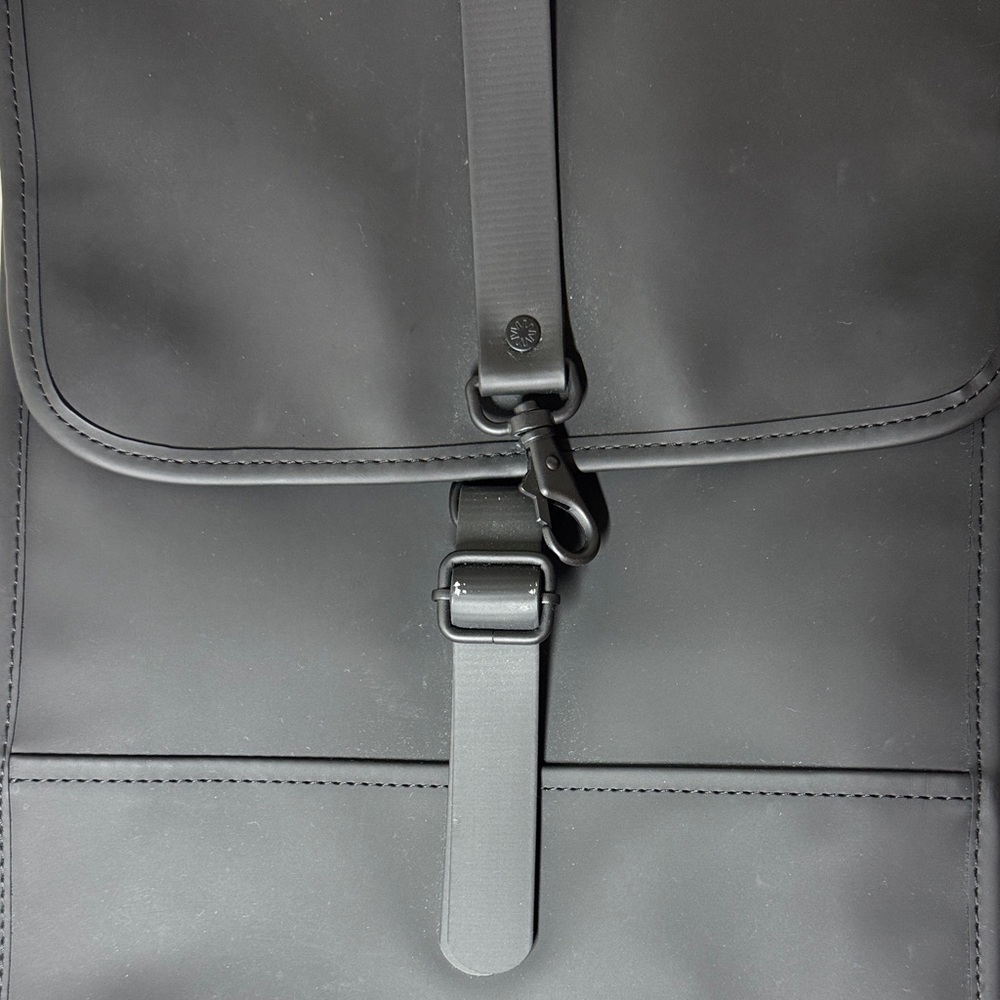 Rains waterproof  black backpack.